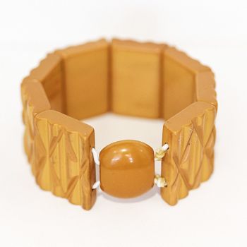 Art Deco Era Bakelite bangle, bracelet.  Carved butterscotch bakelite “elasticised” segmented bracelet.