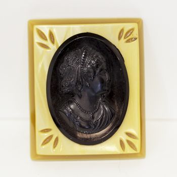 Deco era Rectangular Black intaglio Cameo brooch on marbled buterscotch bakelite mount.