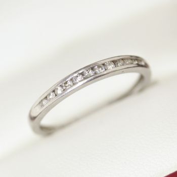 A platinum Vintage diamond eternity ring with 12 diamonds channel set