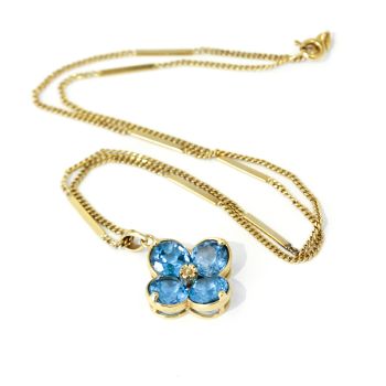 Vintage blue Topaz  flower shaped pendant on a yellow gold chain, Beautiful.
