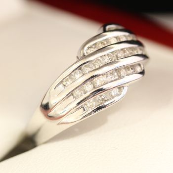 White gold and diamond wedding band ring, with 31 channel set diamonds. 