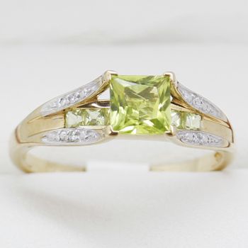 Green Peridot Claw Set Floating Above Seven Square Cut Peridots, with Diamond Shoulders, Vivid Green, Estate Age