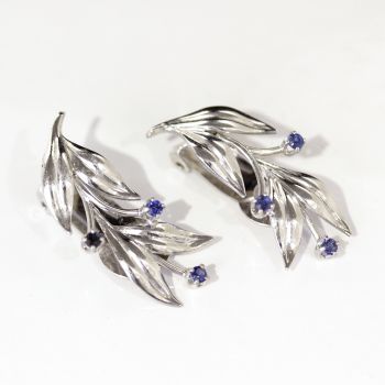 Vintage clip on leaf shaped white gold and sapphire earrings. Very elegant.