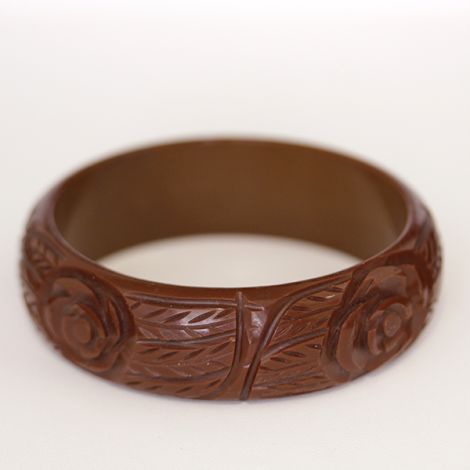 Art Deco era Mahogany Bakelite bangle, with carved flower and leaf design.