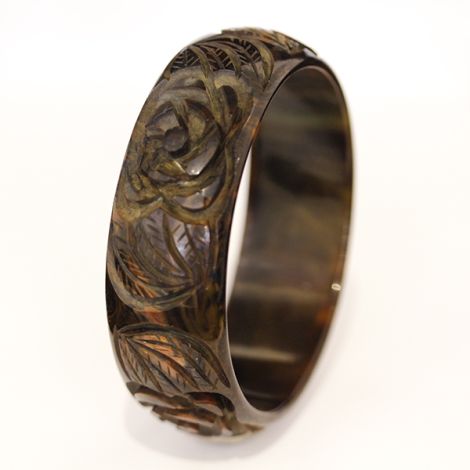 Great Vintage Hunter Green with Butterscotch swirl carved Bakelite bangle. 