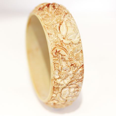 Art Nouveau heavily carved Bakelite bangle.  Early Bakelite Bangle.