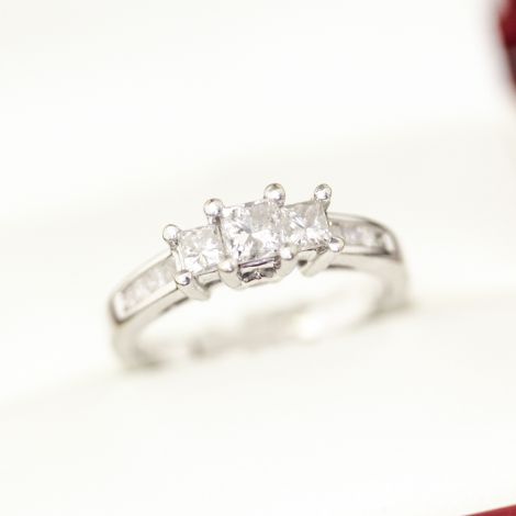 Diamond engagement ring, featuring 8 side princess cut Diamonds, White gold