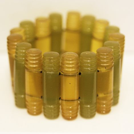 Art Deco Bakelite Apple and Lime coloured carved elasticised segmented bracelet.  