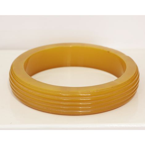 Art Deco era Butterscotch Bakelite bangle, with line carving detail.