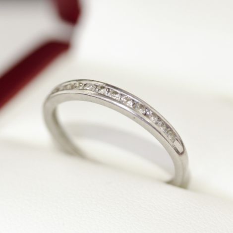 A platinum Vintage diamond eternity ring with 12 diamonds channel set