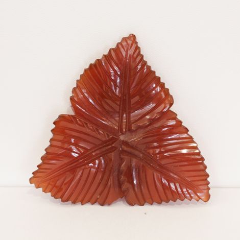 Great Deco carved, leaf shaped dress clip, in transulcent Amber Bakelite.