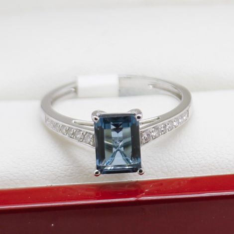 Emerald cut sapphire engagement ring