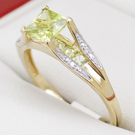 Green Peridot Claw Set Floating Above Seven Square Cut Peridots, with Diamond Shoulders, Vivid Green, Estate Age